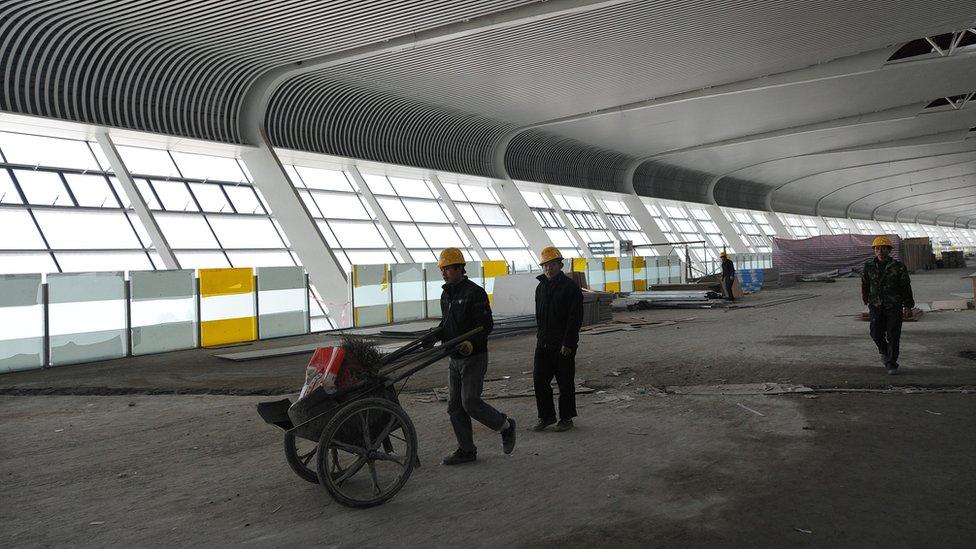 Workers building a new airport in Hefei, in China's Anhui province