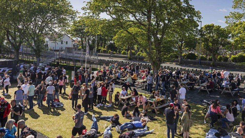 People in the fan park at the grandstand