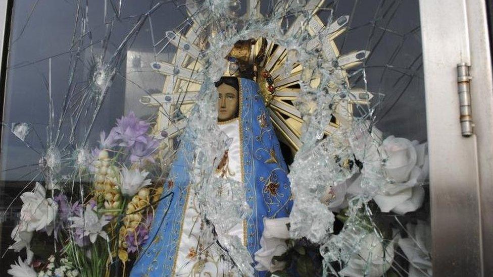 Image of Virgin Mary behind shattered glass near Darwin on the Falklands (Picture released by Commission of Families of Fallen soldiers 30 Jul 2012)