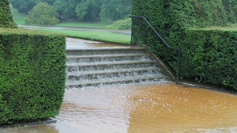 Water cascading down the steps in the garden at Lyme Park