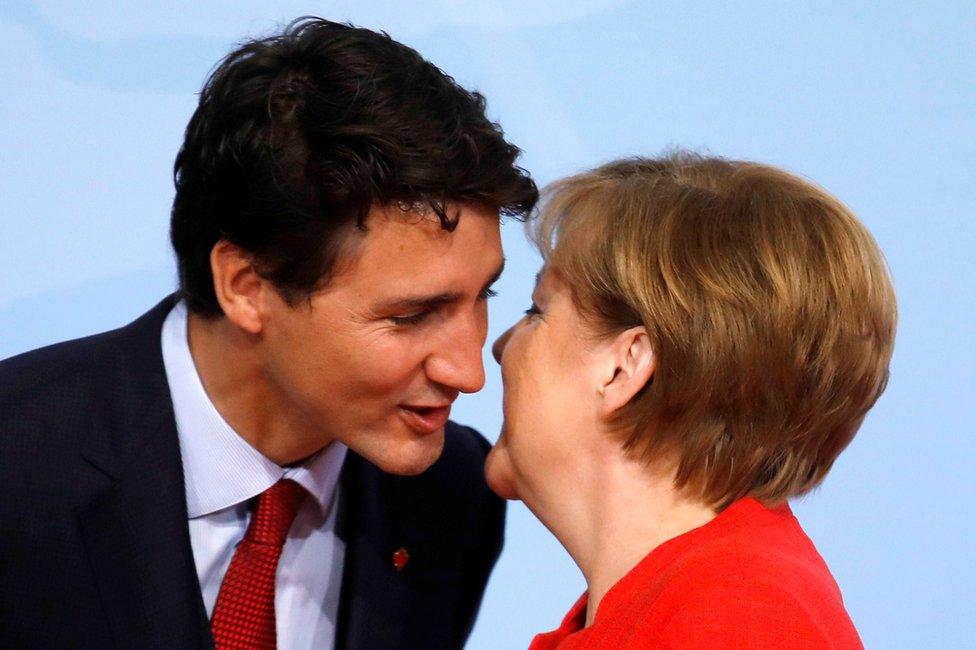 German Chancellor Angela Merkel welcomes Canadian Prime Minister Justin Trudeau at the G20 summit in Hamburg, Germany, 7 July