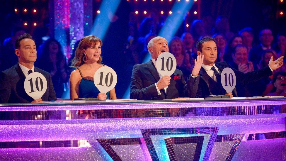 Strictly Come Dancing judges holding up 10s