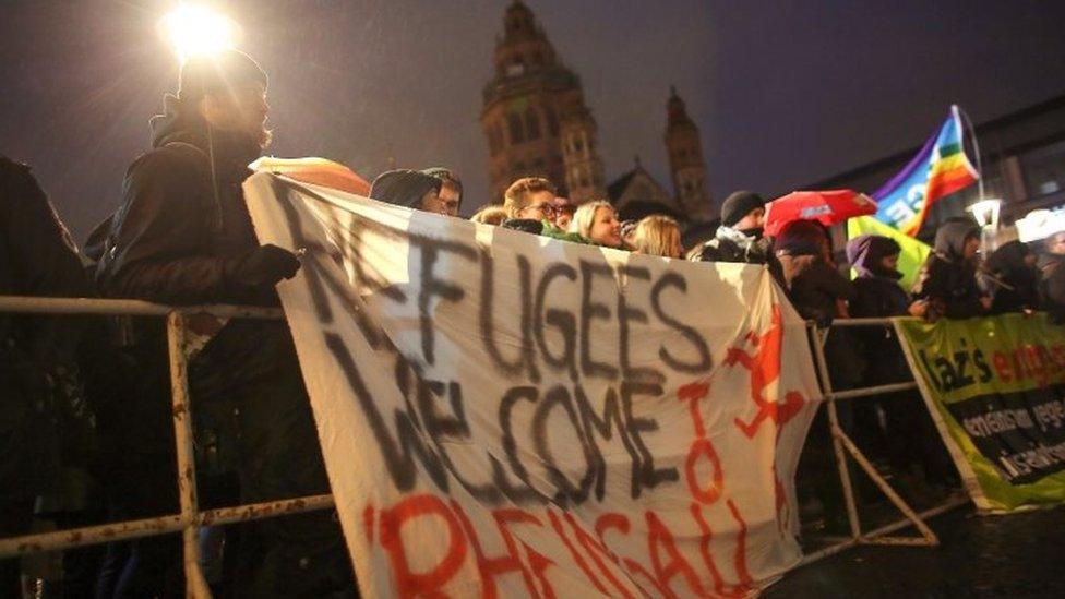 People stage a counter-demonstration against an anti-migrant rally in Mainz. Photo: 21 November 2015