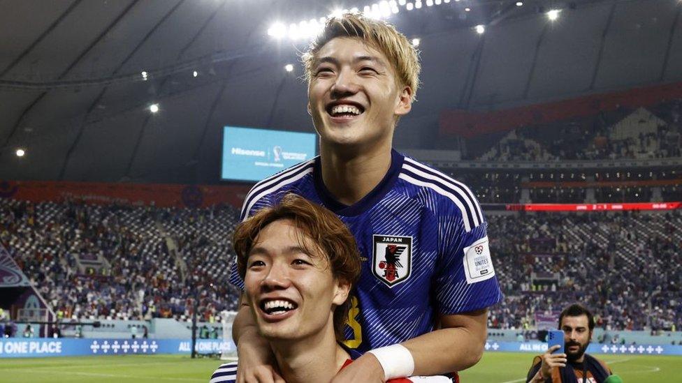 Japan players celebrating victory over Spain