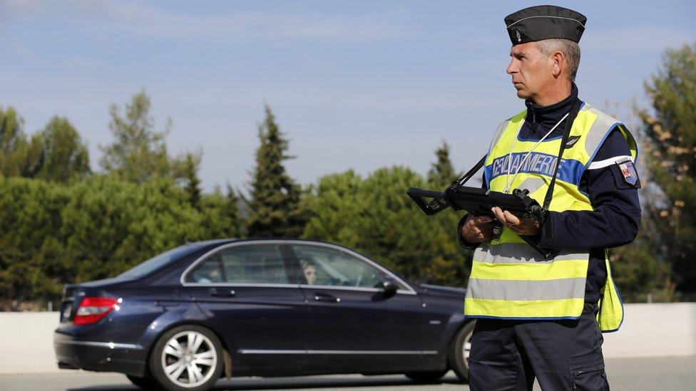 Border control police check cars in the border between France and Italy in La Turbie, France, 14 November 2015.