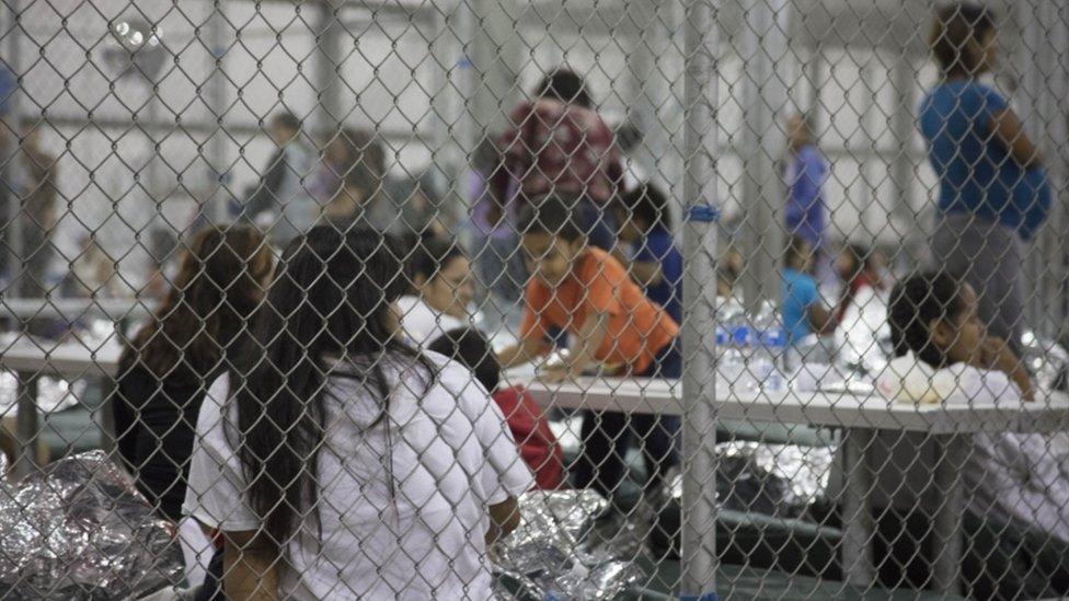 In this handout photo provided by US Customs and Border Protection, US Border Patrol agents conduct intake of illegal border crossers at the Central Processing Center on June 17, 2018 in McAllen, Texas