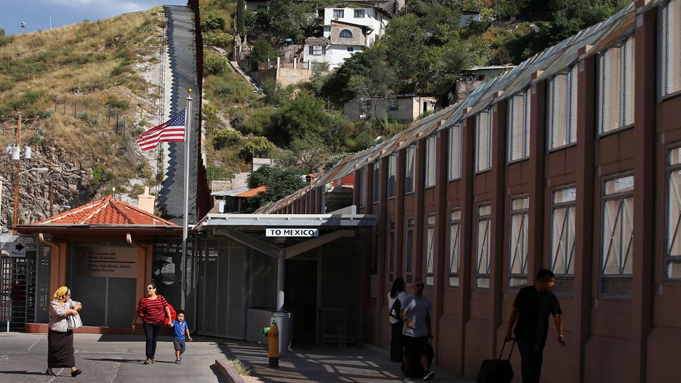 Pedestrians make their way into the the United States from Mexico at the pedestrian border in Nogales, Arizona, United States, October 9, 2016