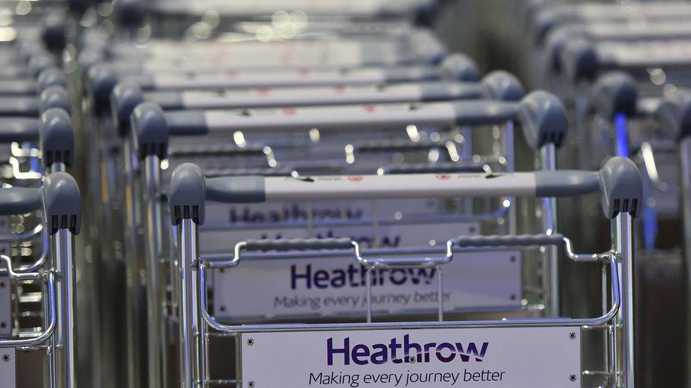 Baggage trolleys stand in rows in the baggage reclaim hall at Terminal Two at Heathrow Airport west of London on April 23, 2014.