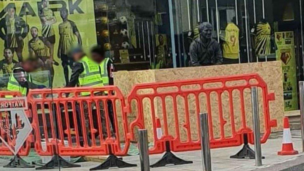 Statue being boarded up