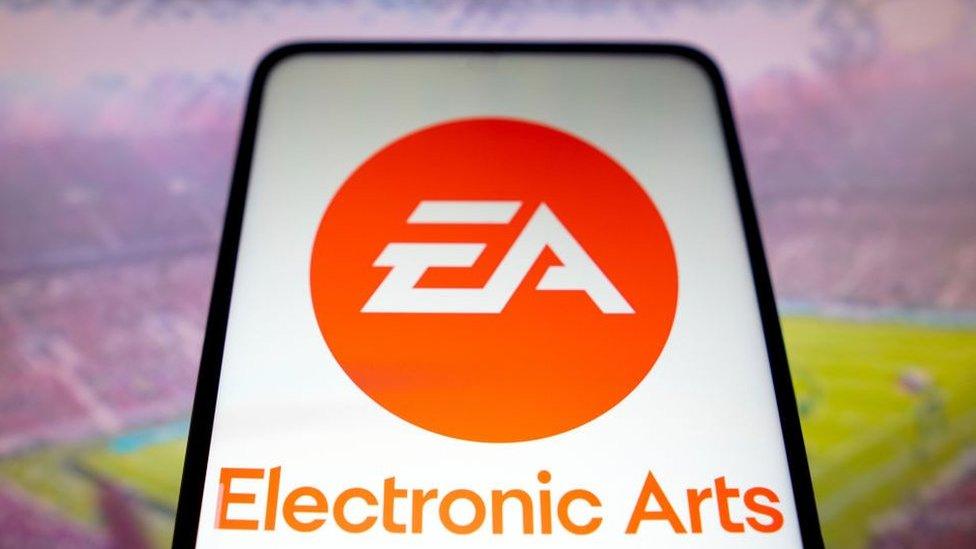 EA logo against background of a football pitch