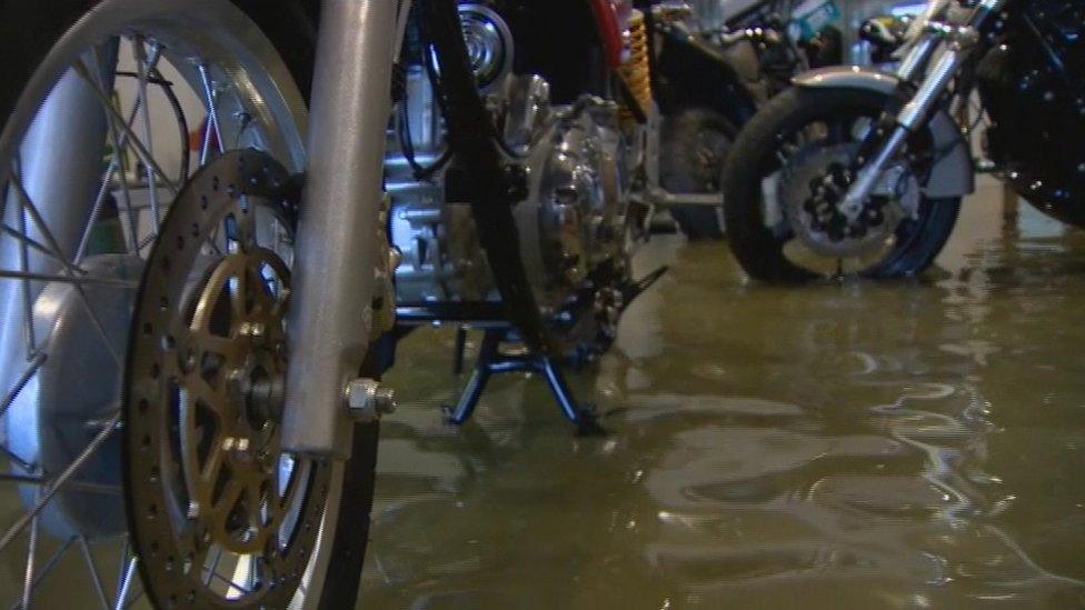 Flood waters inside a motorcycle business at Kinnego Marina on the shore of Lough Neagh