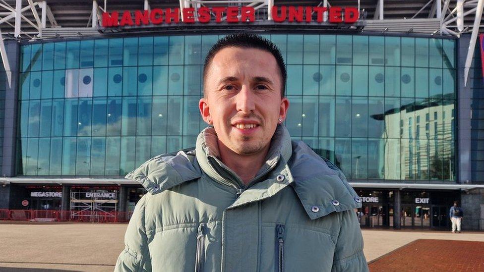 Fan outside Old Trafford Stadium