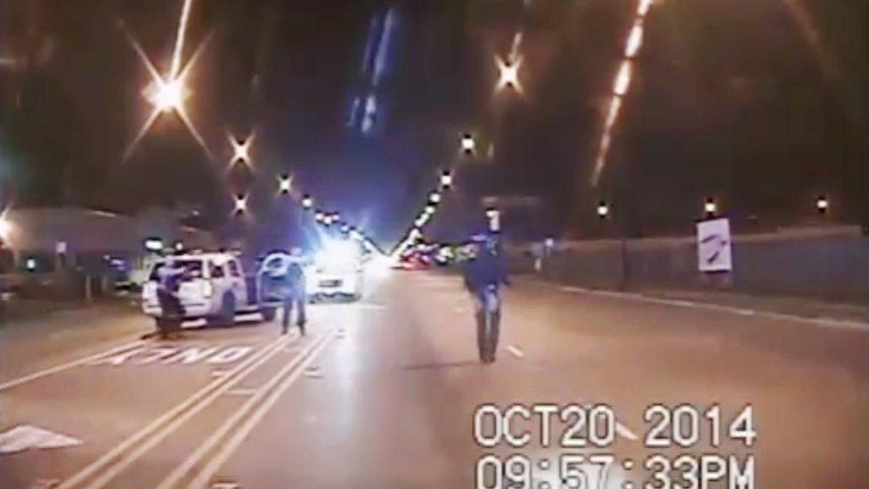 In this frame from dash-cam video provided by the Chicago Police Department, Laquan McDonald, right, released on 20 October 2014walks down the street moments before being fatally shot by CPD officer Jason Van Dyke sixteen times in Chicago.