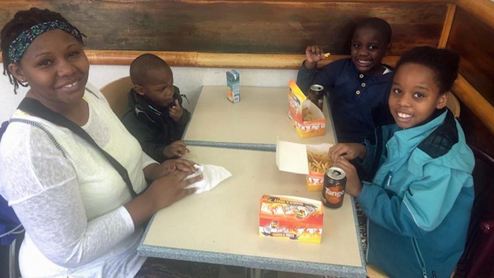 Jackie Mudimi and her children in Chicken Cottage