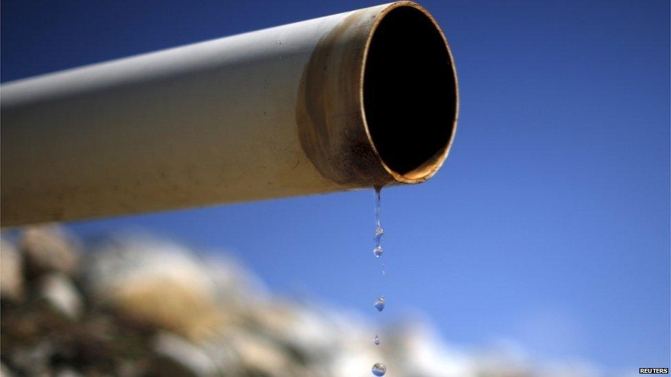 A dry pipe drips water on Gless Ranch in Kern County, California, in this file photo taken on 23 July 2015.