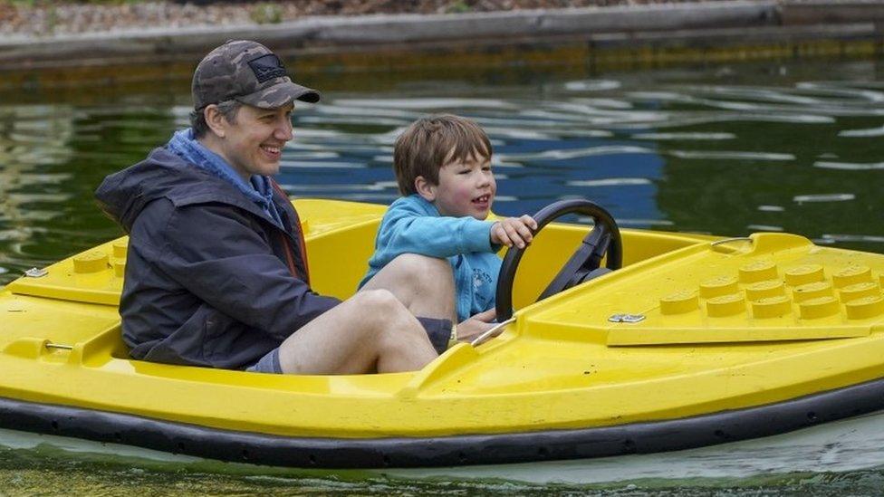 Duncan Brett with his disabled son Sebby, seven, during a visit to Legoland