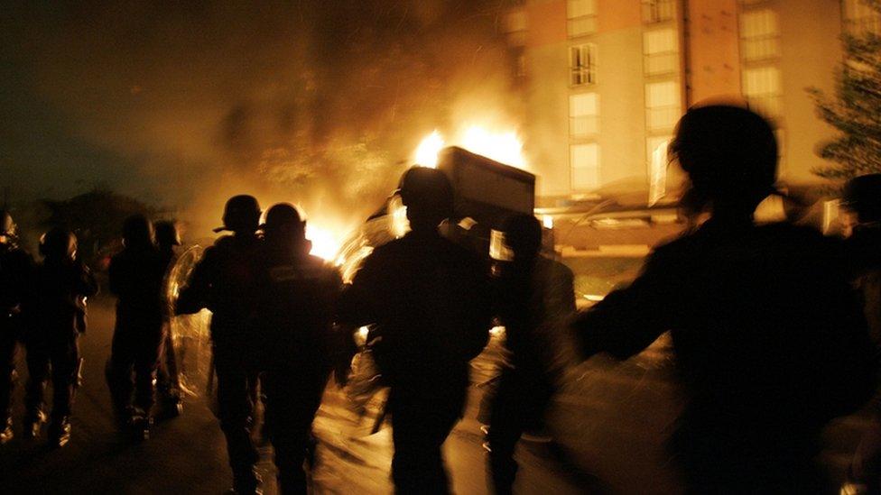 Riot police patrol the Paris suburb of Aulnay-sous-Bois on the seventh consecutive night of violence in the suburbs of Paris and other cities in France, November 2005