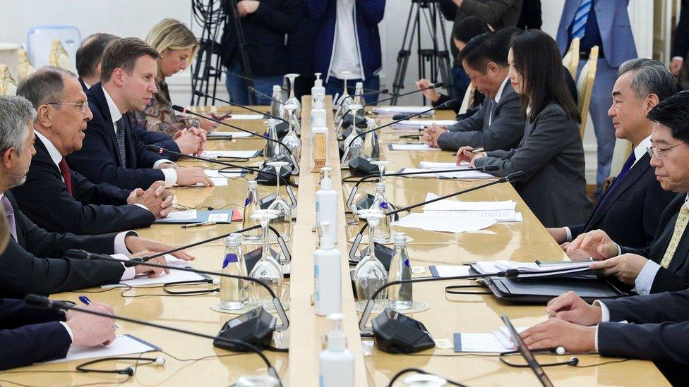 A handout photo made available by the Russian Foreign Ministry's press service shows Russian Foreign Minister Sergei Lavrov (2-L) speaking with Chinese Foreign Minister Wang Yi (2-R) during their meeting in Moscow, Russia, 18 September 2023.