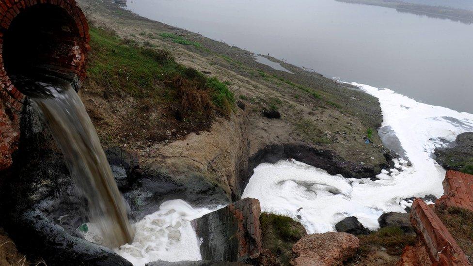 Polluted waste water flows into the Ganges river in Kanpur, in the northern state of Uttar Pradesh on January 13, 2010.