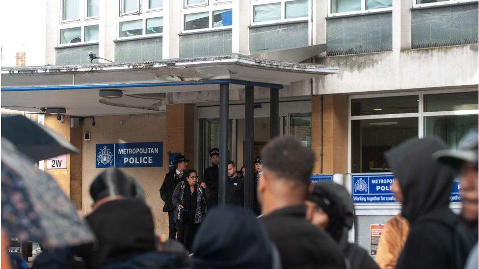 Protesters outside of Brixton Police station