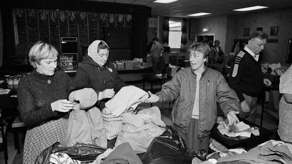 Women sort through donations at Kiveton Park miners' club