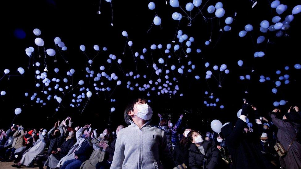 Revellers release balloons as they take part in New Year celebrations in Tokyo, Japan