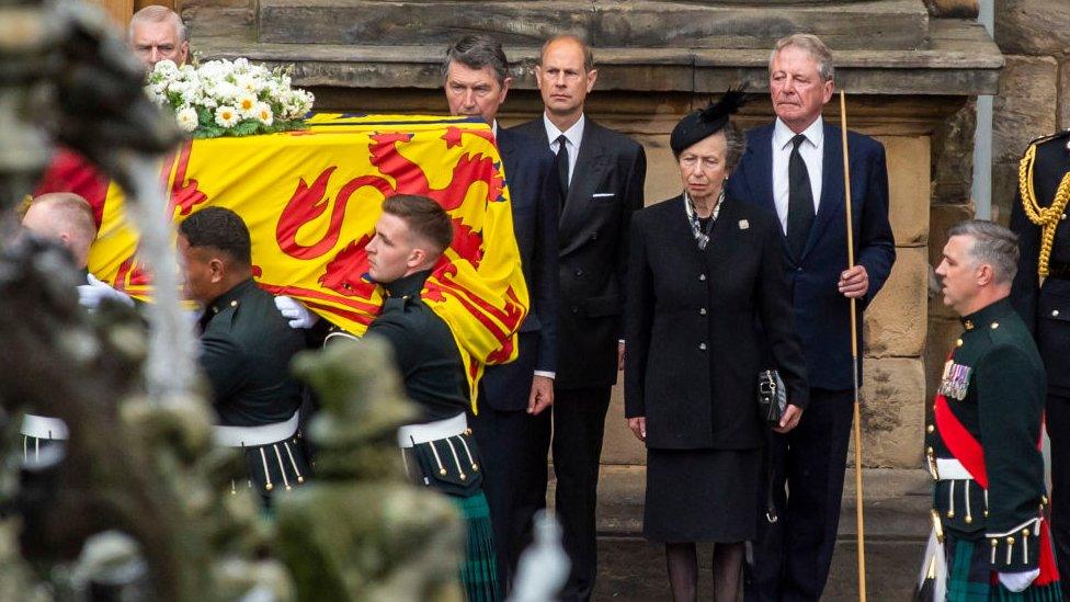 Princess Anne and the Royal Family wait alongside the Queen's coffin during the pallbearer procession