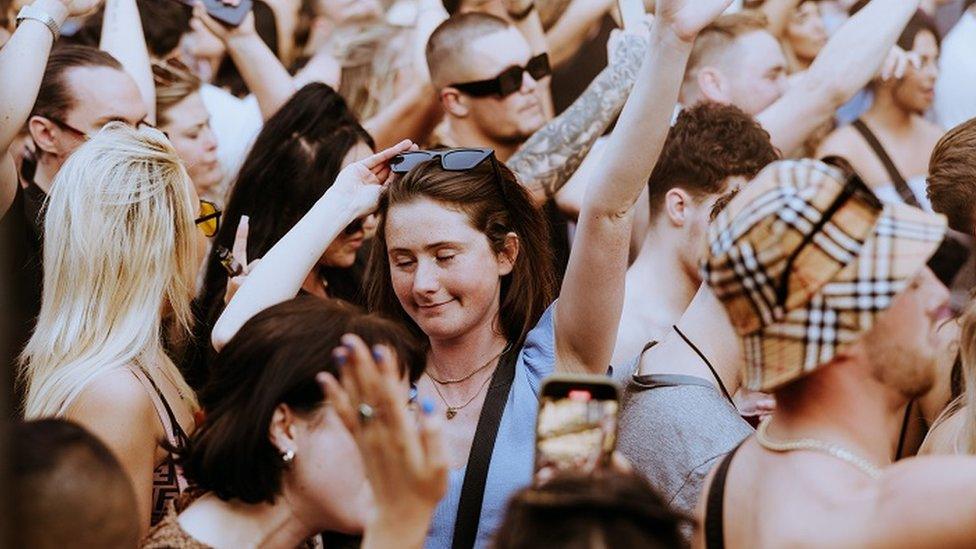 People dancing with their hands in the air at the Cafe Mambo event at Motion in Bristol