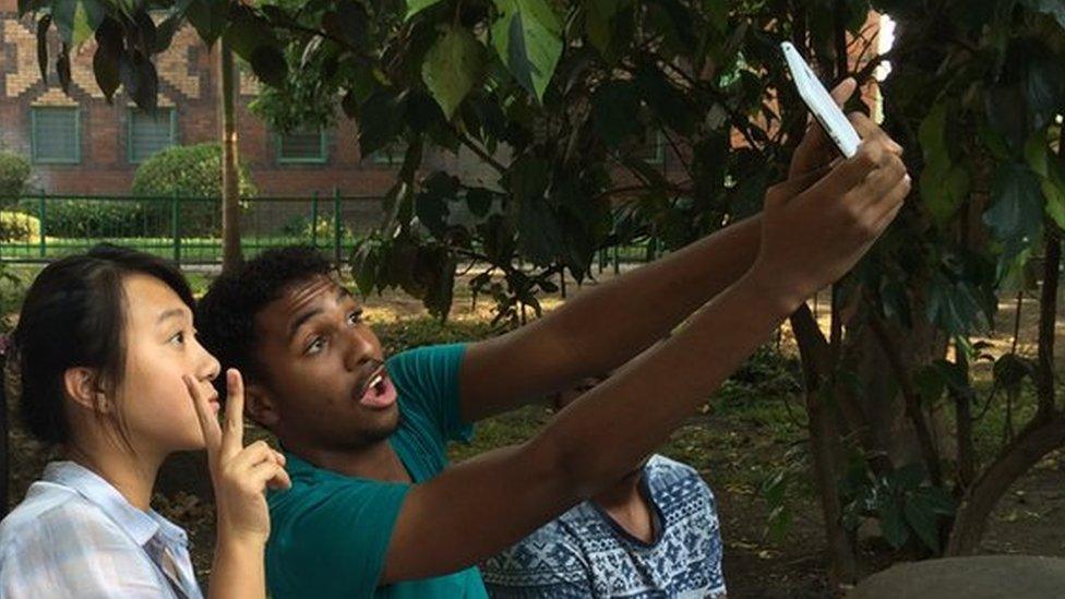 Lu Cheng with taking a 'selfie' with Zambian friends