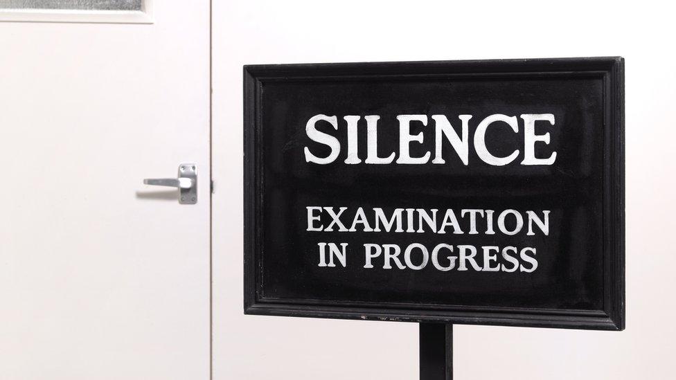 exam in progress sign.