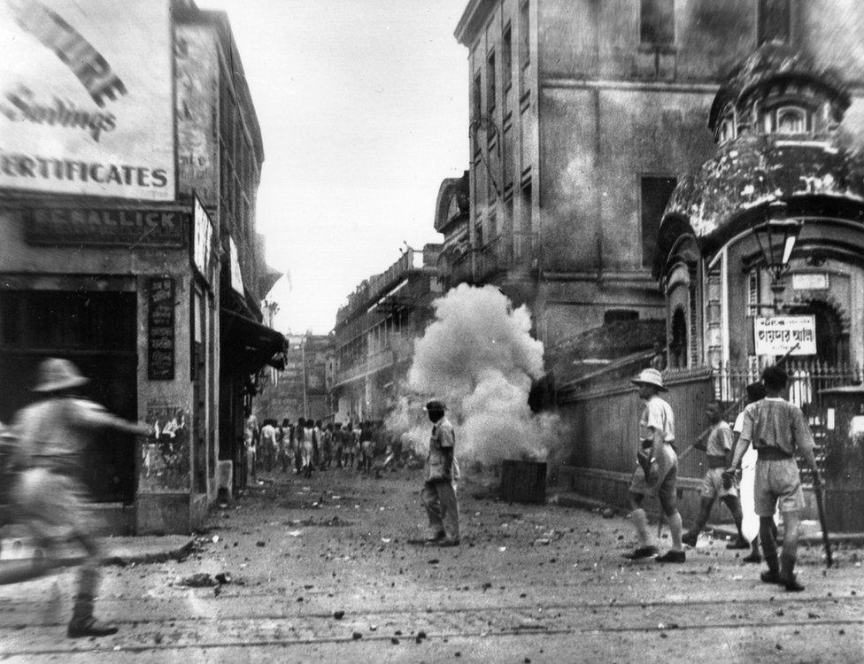 Policemen use tear gas bombs during the communal riots in Kolkata (Calcutta) ahead of Partition