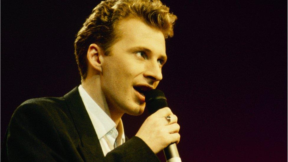 Colin Vearncombe, known as Black, performing on stage in around 1987