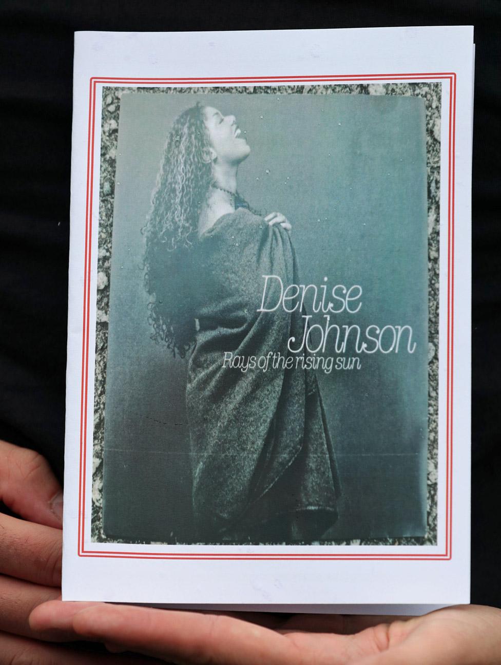 A person holding the order of service at Denise Johnson's funeral