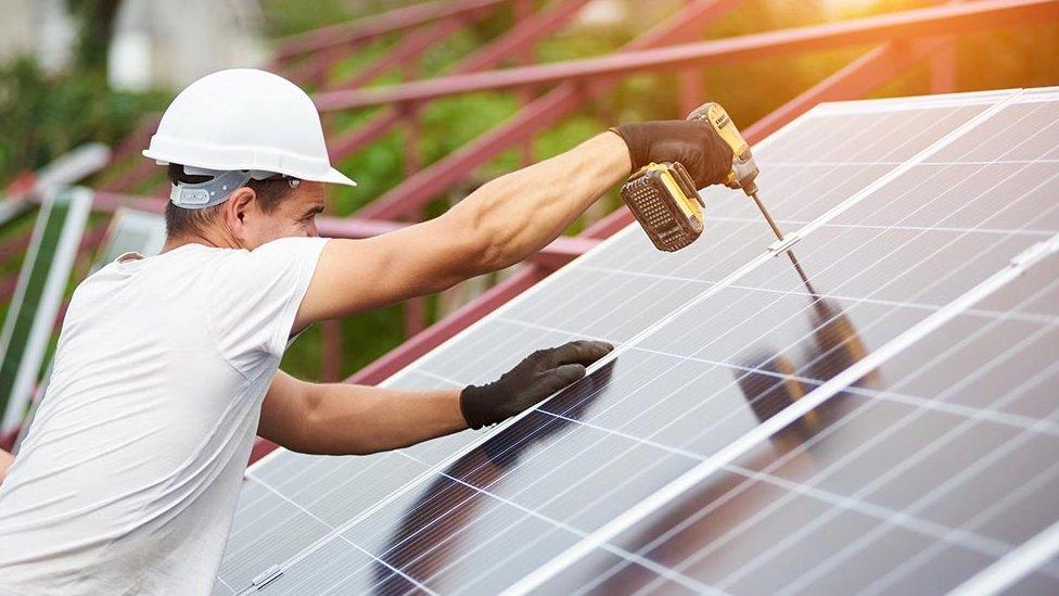 Solar panels being installed