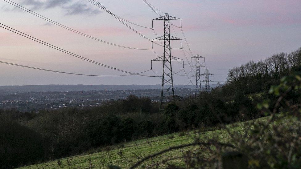 Electrical power lines and pylons in Belfast, Northern Ireland, U.K.. Photographer: Hollie Adams/Bloomberg