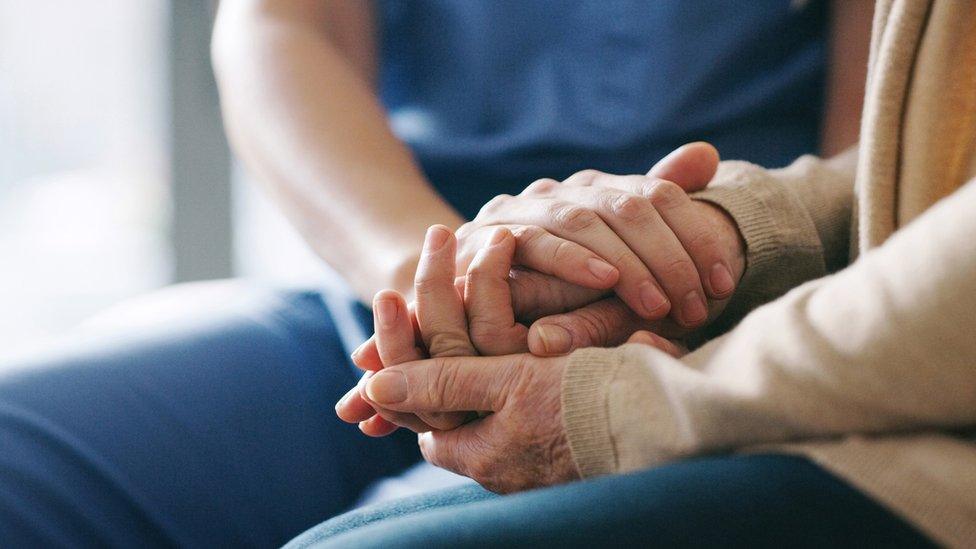 Close-up view of nurse with elderly woman (care generic)