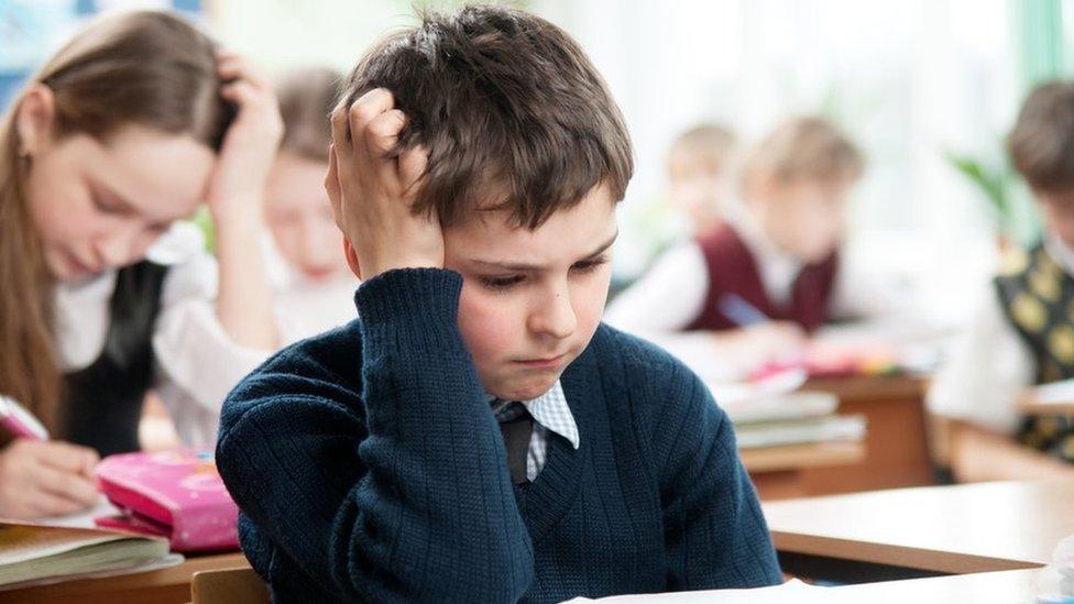 A child taking an exam