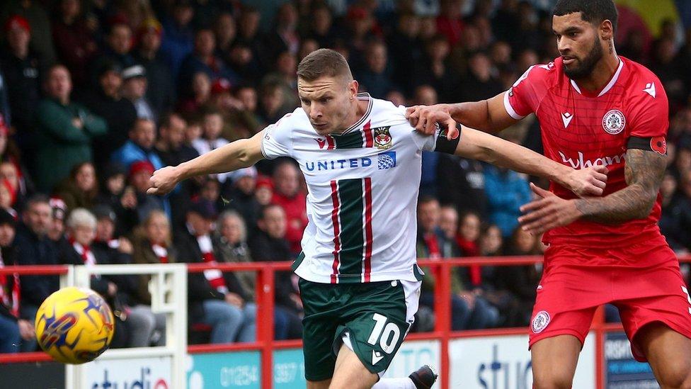 Jay Rich-Baghuelou challenges Wrexham's Paul Mullin