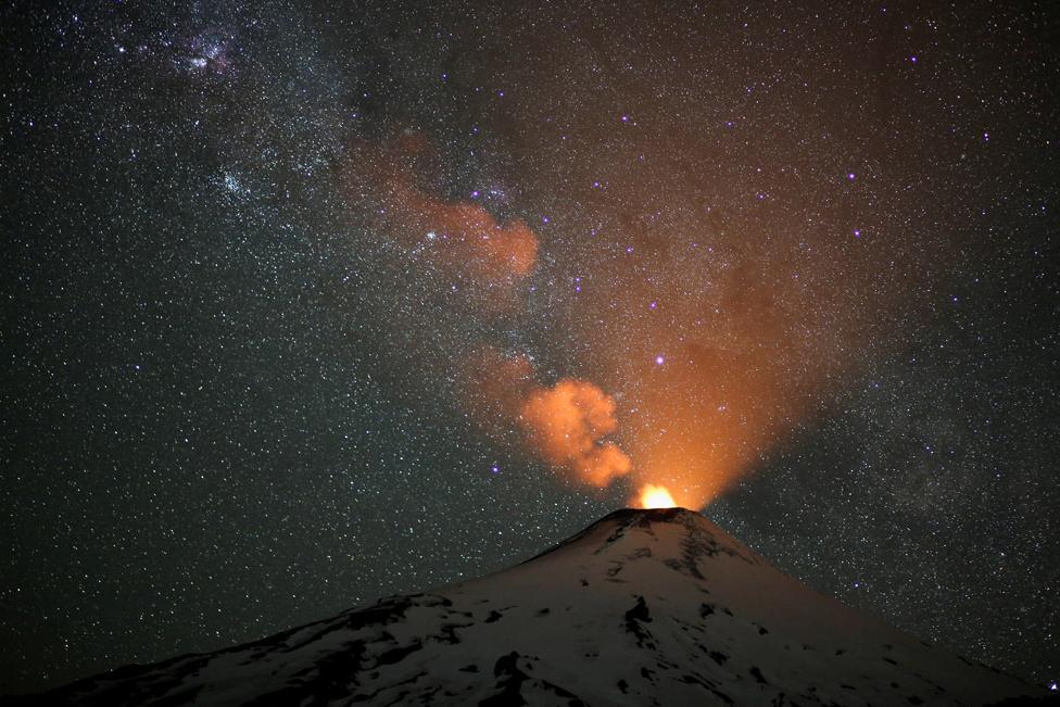 Plumes of smoke rise from the snow covered volcano Villarrica, in Pucon, Chile. December 7, 2023.