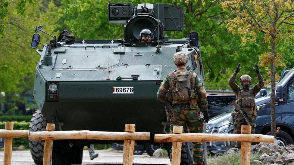 Soldiers and an armoured vehicle near the entrance of the Hoge Kempen National Park