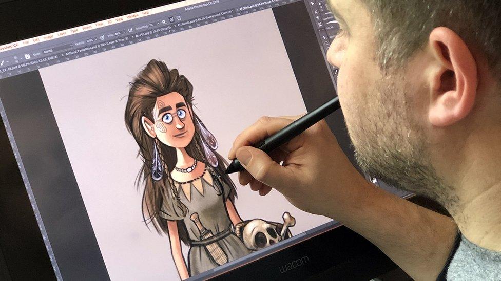 Artist Alex Leonard working on one of the characters