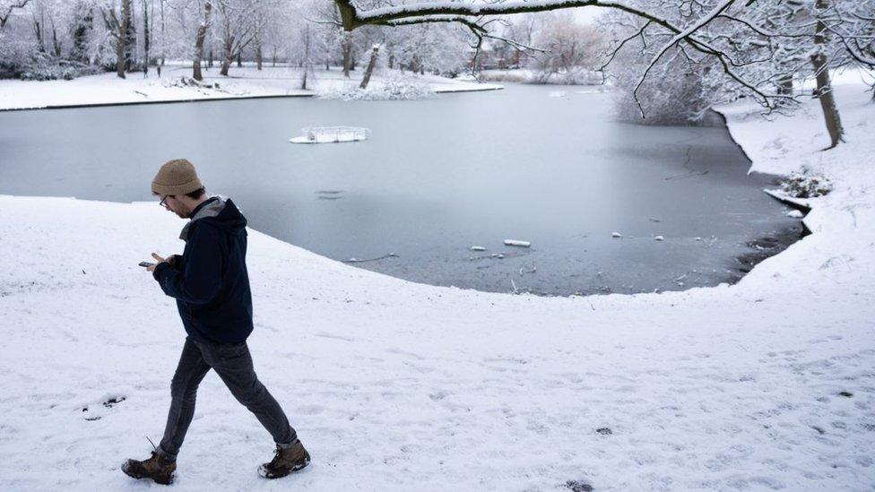 Man walking by Greenbank Park