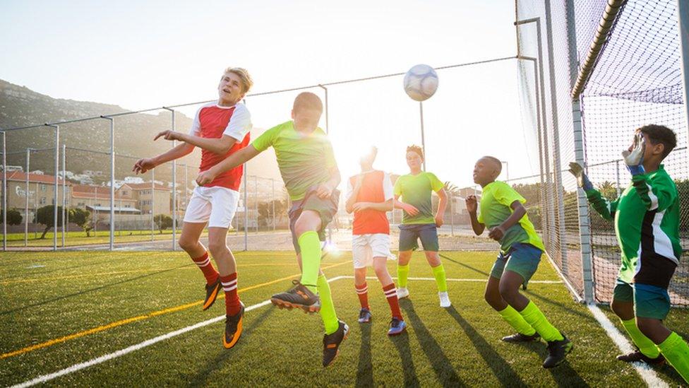 kids playing football