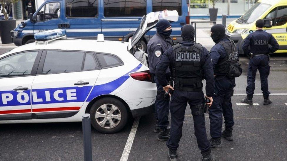 French police forces stand outside Orly airport, south of Paris, Saturday, 18 March 2017