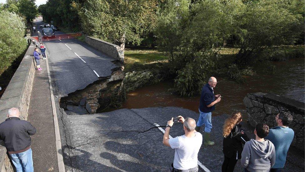 A gaping hole in a bridge in County Londonderry, caused by flooding