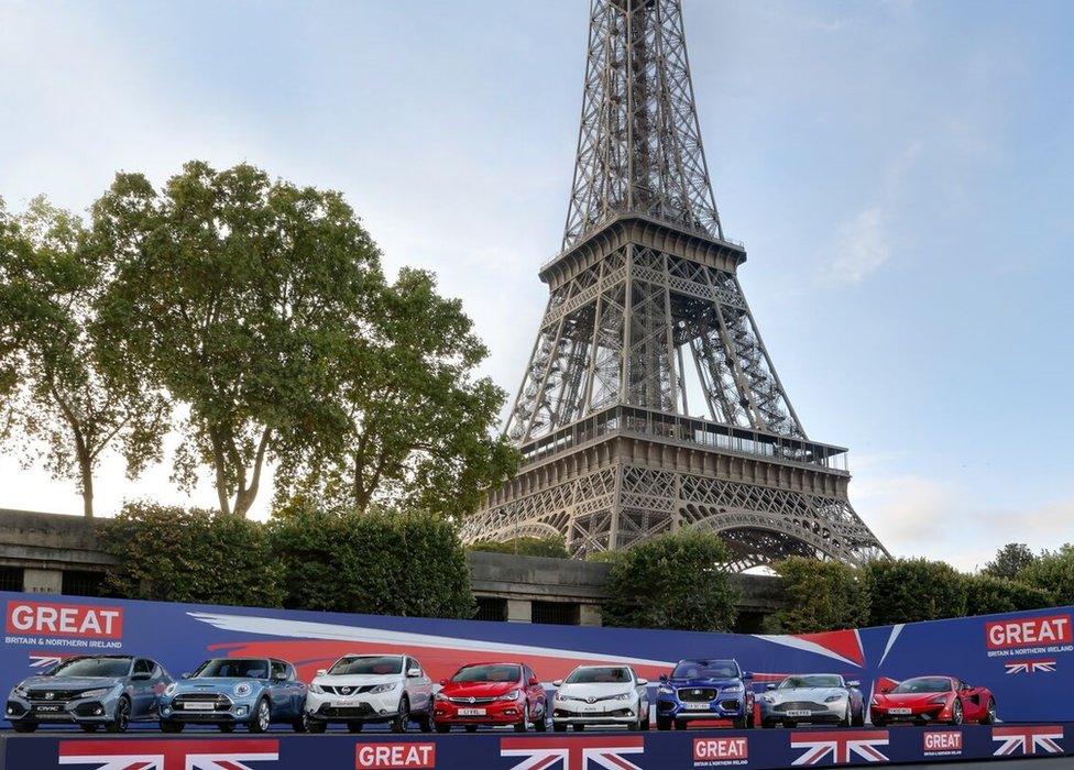 British-made cars in front of the Eiffel Tower