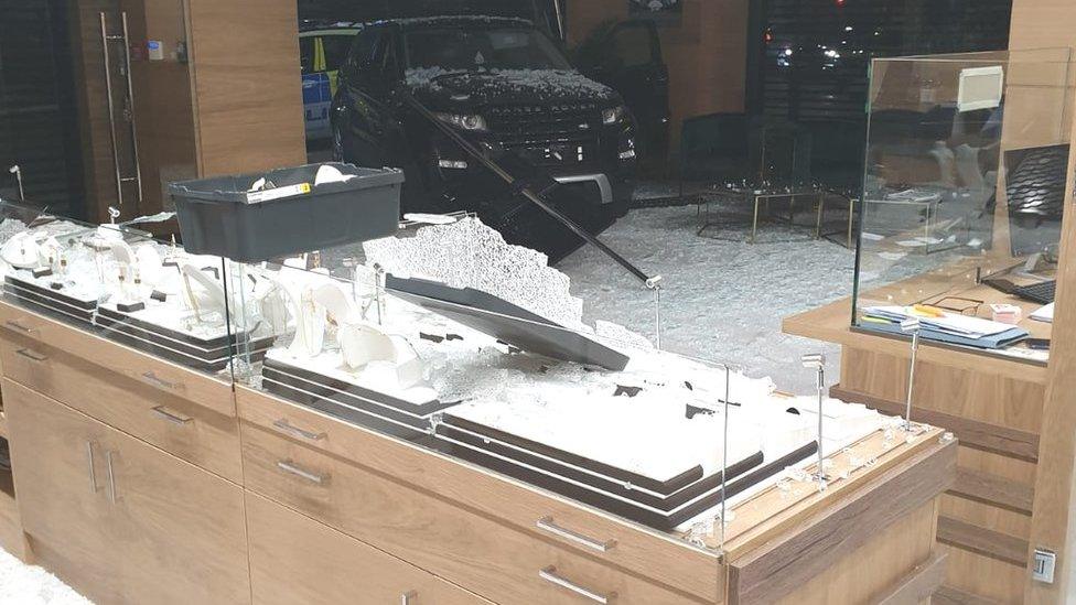 Car driven into shop