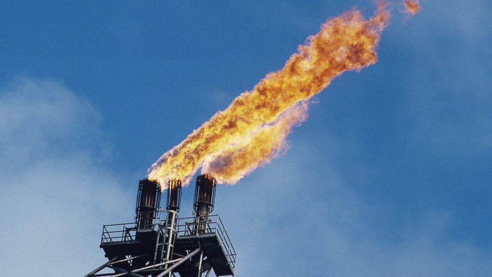 flames burning off gas at platform