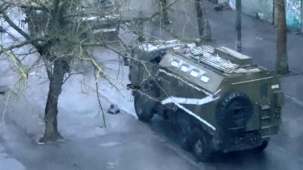 A military truck and tank are seen on a street of Kherson, Ukraine. Photo: 1 March 2022