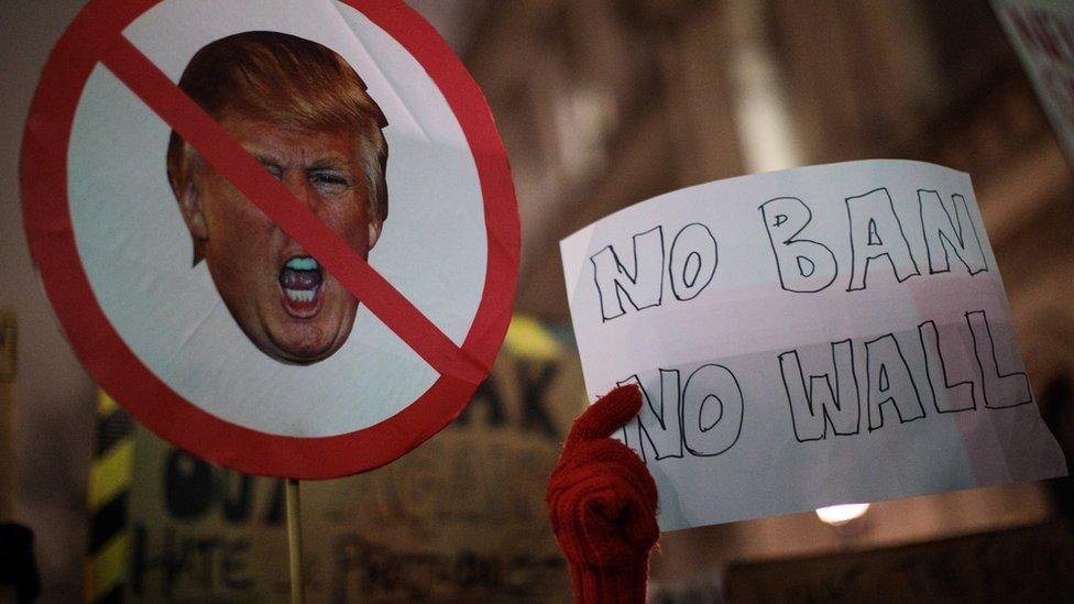 Demonstrators hold up placards during a protest outside Downing Street against U.S. President Donald Trump's ban on travel from seven Muslim countries on January 30, 2017 in London, England. President Trump signed an executive order on Friday banning immigration to the USA from seven Muslim countries. This led to protests across America and, today, in the UK, a British petition asking for the downgrading of Trump's State visit passed one million signatures this morning.